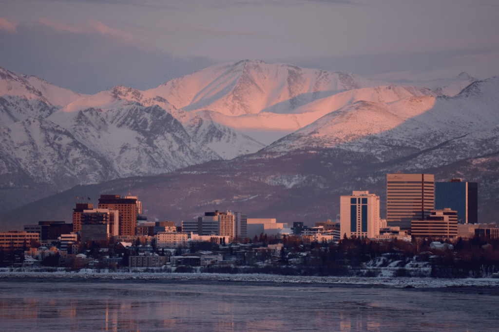 Sunset View Of City Of Anchorage Across Sea With Mountains Behind Is Alaska In Canada Or Usa