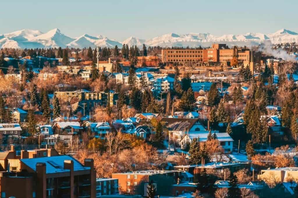 Affordable Residential Housing Area In Calgary With Snow Covered Mountains In The Background One Of The Best Reasons To Move To Alberta Canada